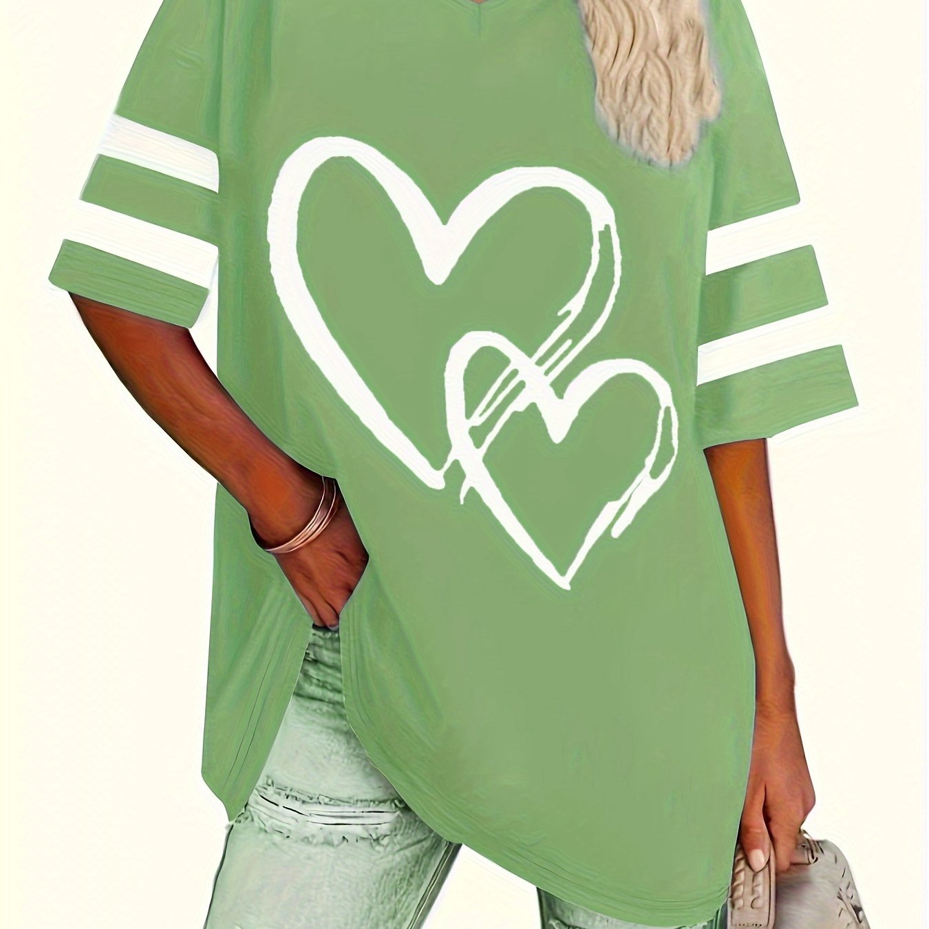 Plus-size heart-print V-neck tee in green with positioning print, casual style.