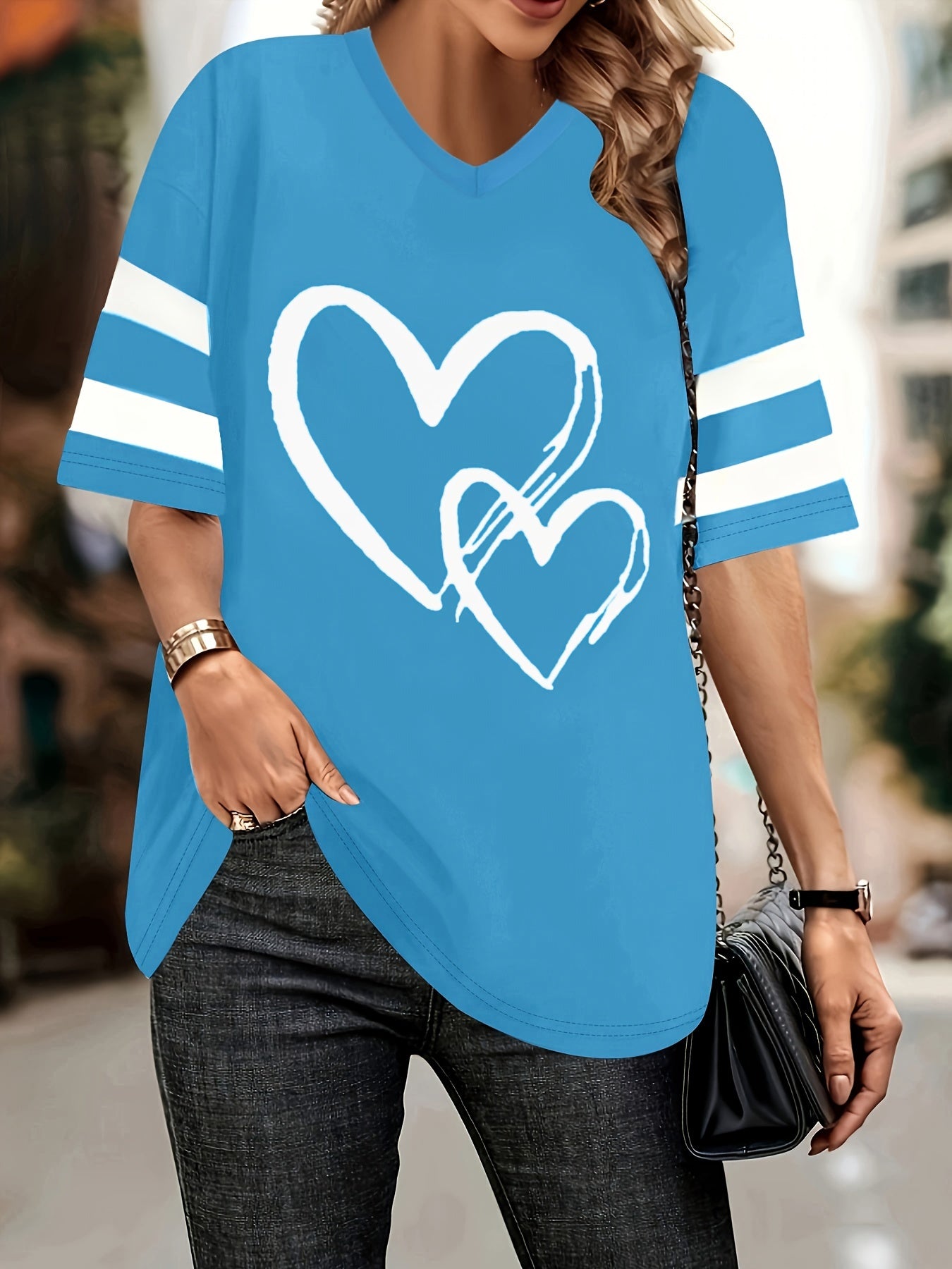 Plus-size heart-print V-neck tee with white heart design and casual style.