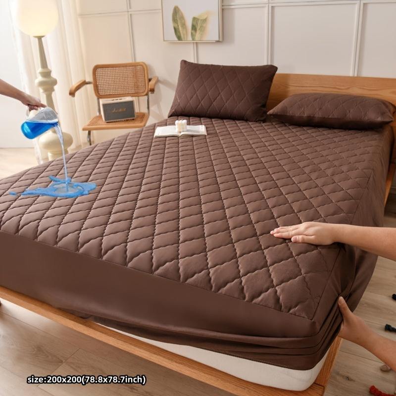 Waterproof mattress protector cover in mixed color on a bed, showing ultra soft and quilted design.
