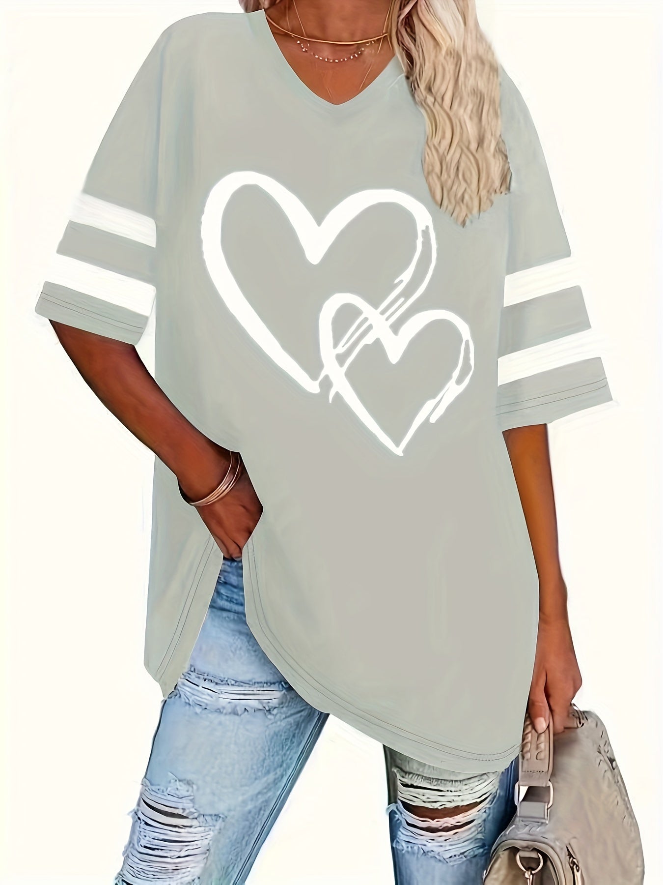 Plus-size heart-print V-neck tee with casual style and slight stretch fabric.
