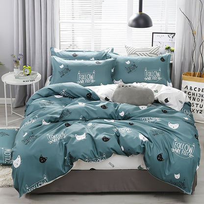 Cute cat pattern bedding set with multiple components and zipper closure, displayed on a bed.